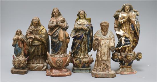 A collection of six 18th / 19th century South American polychrome painted figures of the Virgin Mary and five saints tallest 21cm